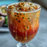 Gorgeous Tropical Sunrise Mocktail, ready to sip, bursting with fruity flavor.