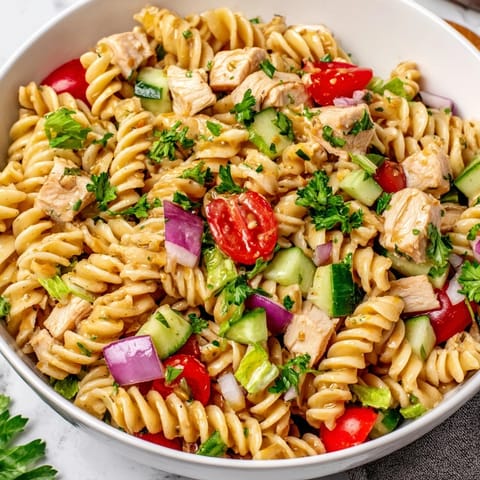 Tender chicken and rotini pasta tossed in a zesty honey mustard dressing.