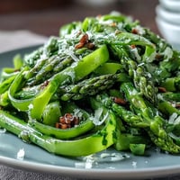 Shaved asparagus ribbons tossed with lemon and Parmesan create a fresh, vibrant spring salad.